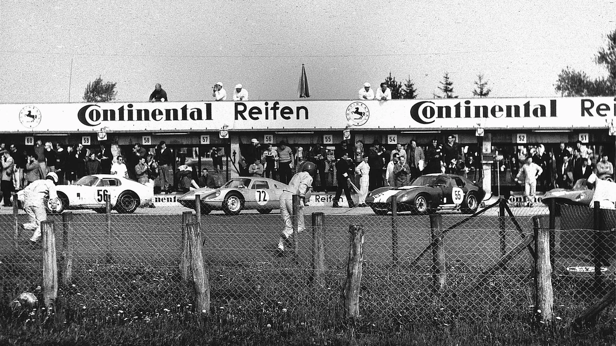 Drivers running across track in classic le mans start procedure